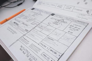 A sketch of a web design on a desk.